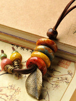 Load image into Gallery viewer, Retro ethnic ceramic sweater chain leaf necklace women&#39;s pure knit sweater chain
